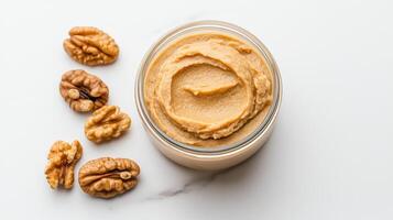 Walnut butter spread on a white background photo