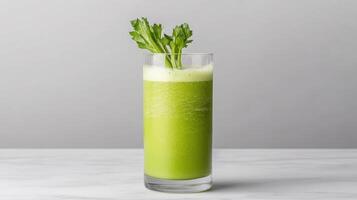 A green drink with a green leaf in it photo