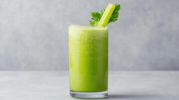 A green drink with celery in it photo