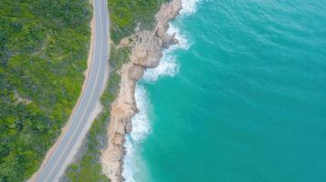 Aerial view of road on the coast of the ocean photo