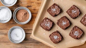 Chocolate brownies on a baking sheet with salt photo