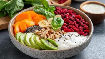 A bowl of fruit and vegetables with yogurt and other ingredients photo