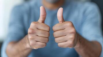 A man is giving the thumbs up sign photo
