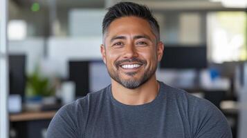 A man in an office smiling photo