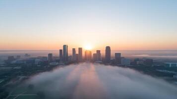 A city skyline is seen in the distance with fog photo