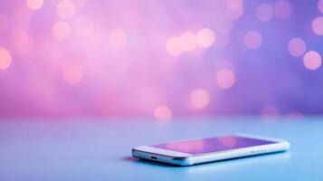 A smartphone on a table with a purple background photo