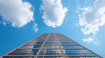 Tall building with blue sky and clouds photo