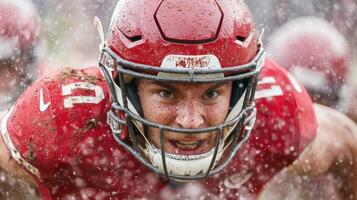 A football player is running through the rain photo