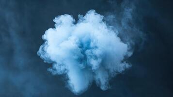 Blue smoke cloud on a dark background photo