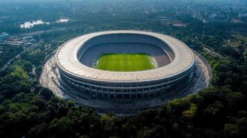 The stadium is surrounded by trees and grass photo