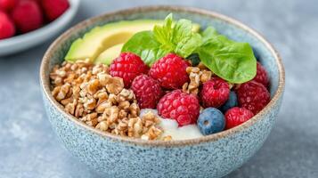Yogurt with berries and avocado in a bowl photo