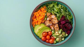 A bowl of salad with chicken, vegetables and tomatoes photo