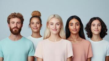 Group of people standing in front of a gray background photo