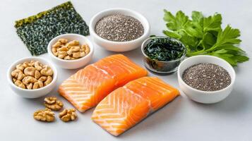 Salmon, nuts, seeds and herbs in bowls photo