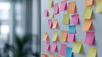 Post-it notes on a white board photo