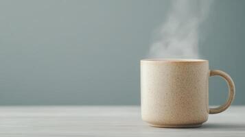 A coffee cup with steam coming out of it photo