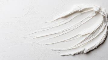 A white substance is shown on a white surface photo
