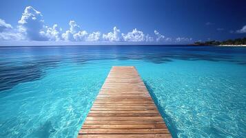 serene beach scene captures essence of vacations with wooden pier extending into crystal clear turquoise waters under bright blue sky. tranquil atmosphere invites relaxation and exploration photo