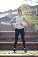 Fit Woman Model In Activewear Posing In Front Of Camera photo