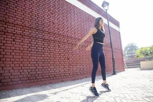 Beautiful Female Doing Jumping Squats Exercise photo