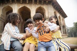 Joyful Kids Tickle Each Other And Giggling photo