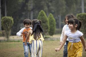 Nursery Kids Playing Blindfold Game With Friends photo