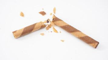 Cocoa filled wafer rolls with a crispy texture isolated on white background photo