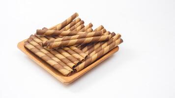 Chocolate infused wafer rolls with a light and crispy texture isolated on white background photo