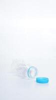 Crumpled plastic bottle waste isolated on white background photo