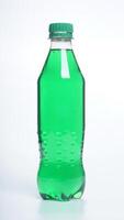 Green colored water in plastic bottle with green bottle cap isolated on white background photo
