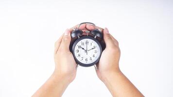 Classic design of black alarm clock isolated on white background photo