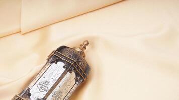 Muslim decoration for Ramadan and Eid al-Fitr with beige fabric isolated on white background photo