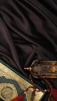 Various kind of decorations for Ramadan and Eid al-Fitr on black fabric background photo