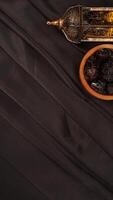 Elegance muslim decoration for Ramadan and Eid al-Fitr on black fabric background photo