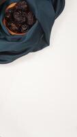 Muslim decoration for Ramadan and Eid al-Fitr with dark green fabric isolated on light background photo