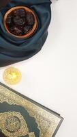 Beautiful muslim decoration for Eid al-Fitr and Ramadan with dark green fabric on light background photo