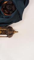 Muslim decoration for Eid al-Fitr and Ramadan with dark green fabric isolated on light background photo