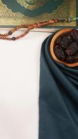 Elegance muslim decoration for Eid al-Fitr and Ramadan with dark green fabric isolated on light background photo
