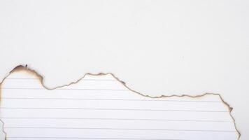 White stripped paper with burnt edges isolated on white background with clipping path photo
