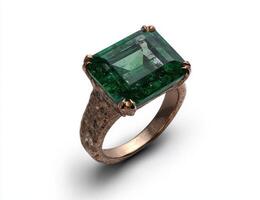 A gold ring with a large green emerald gemstone photo