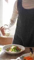 Seasoning a Delicious Meal While Preparing It in a Bright and Inviting Kitchen Setting video