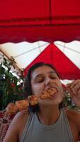 Savoring Appetizing and Delicious Skewers While Enjoying a Charming Outdoor Atmosphere video