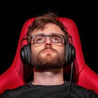 Immersed in web of sound, this individual enjoys streaming on platform designed for gamers, showcasing focus and concentration photo