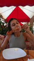 Savoring the Delightful Taste of Delicious Skewers While Relaxing in a Cozy Outdoor Setting video