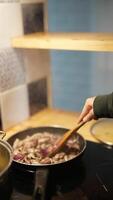 Cooking a Variety of Colorful and Nutritious Vegetables in a Pan Using a Wooden Spoon video