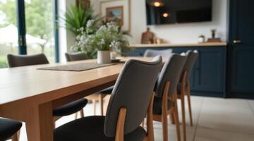 modern light oak dining table with gray upholstered chairs photo