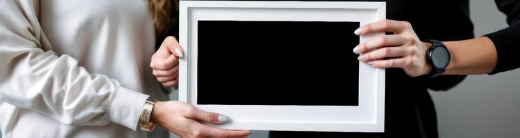 two hands presenting a blank frame photo