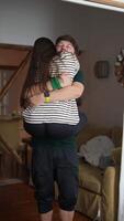 A loving couple joyfully embracing each other at home, surrounded by warmth and deep affection video