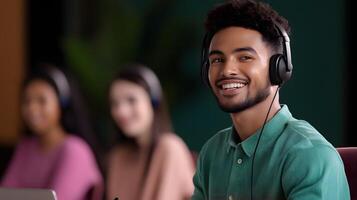 A smiling teacher wearing a headset while leading an online virtual classroom session from their workspace photo