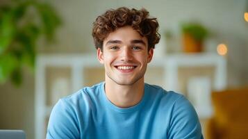 A smiling young man in casual attire sitting at a desk and discussing a startup idea showcasing enthusiasm and focus on future growth and innovation photo